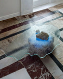 Contemporary glass coffee table with an artistic organic shape. Inspired by natural landscapes and frozen forms.