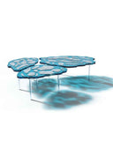Sculptural glass dining table with an organic contemporary profile. Inspired by glacial landscapes and natural textures.