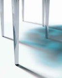 Luxury sculptural dining table with handcrafted glass detailing. Designed for contemporary residential interiors.