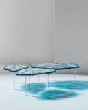 Organic glass table inspired by frozen natural formations. A designer centrepiece for sophisticated dining spaces.