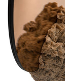 Luxury mirror with a circular reflective surface and sculptural base. Crafted as a statement piece for sophisticated interiors.
