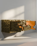 Sculptural storage cabinet inspired by historic cobblestone streets. A designer cabinet featuring textured architectural detailing.