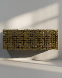 Contemporary storage cabinet showcasing handcrafted surface textures. Inspired by urban architecture and stone paving patterns.