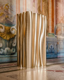 Designer cabinet with flowing handcrafted surfaces and shelving. A statement piece for modern residential spaces.