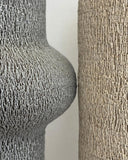 Minimalist ceramic sculpture crafted from stoneware with an artisanal textured finish. A versatile collectible object that introduces sculptural character to contemporary spaces.