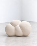 IAMMI Cloud Pouf Chair features a compact arrangement of rounded, upholstered forms in soft ivory fabric. Its low, organic silhouette offers a playful sculptural accent for contemporary residential and hospitality interiors.