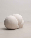 Designer pouf featuring soft sculptural curves and contemporary styling. Crafted as a luxury accent seat for modern interiors.