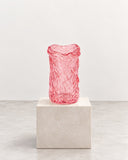 IAMMI Melty Size S features a vivid pink translucent finish with an irregular, rippled surface and softly distorted cylindrical silhouette. This sculptural decorative object adds a playful pop of colour and tactile visual interest to contemporary spaces.