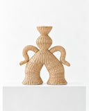 Chan Maak fiber sculpture featuring a stylized figure with curved arms, a sculptural headdress, and a densely woven natural fiber surface. Its distinctive silhouette celebrates handcrafted contemporary collectible design.