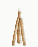 Sculptural floor lamp handcrafted from woven natural fibre with an organic silhouette. A designer floor lamp for contemporary luxury interiors.