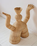 Contemporary fibre object featuring artisanal woven craftsmanship and a sculptural silhouette. Designed as a statement piece for modern interiors.