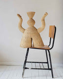 Designer object showcasing handwoven natural fibre and refined organic forms. Crafted to bring texture and contemporary character to sophisticated spaces.