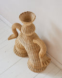 Contemporary woven fibre object featuring artisanal craftsmanship and a soft sculptural silhouette. Designed to create warm in modern spaces.