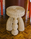 Luxury accent table made from woven natural fibre with a sculptural contemporary profile. Designed for residential and hospitality interiors.