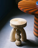 Round side table featuring handwoven natural fibre and artisan craftsmanship. A designer furniture piece for contemporary spaces.