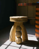 Contemporary woven fibre side table with organic curves and handcrafted detailing. Crafted to complement luxury living environments.