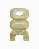 Sculptural object crafted from green marble with a contemporary architectural profile. A designer marble obejct for luxury interiors.