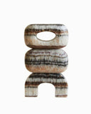 Sculptural object crafted from brown marble with rich natural stone textures. A designer object for contemporary luxury interiors.