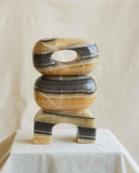 Contemporary yellow marble object featuring distinctive natural stone veining and sculptural craftsmanship. Designed as a statement piece for modern interiors.