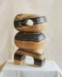 Designer object handcrafted from premium yellow marble with refined geometric proportions. Crafted for sophisticated residential spaces.