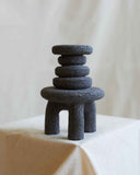 Designer object handcrafted from volcanic rock with sculptural geometry and natural character. Crafted to bring texture and timeless elegance to contemporary spaces.