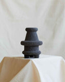 Contemporary volcanic rock object showcasing unique natural stone textures and artisan craftsmanship. Designed as a sculptural focal point for modern spaces.