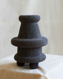 Designer stone object crafted from volcanic rock with an architectural contemporary profile. Created to complement sophisticated interiors.