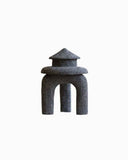 Sculptural volcanic object table featuring a refined monolithic form and natural stone finish. A designer object for contemporary luxury interiors.
