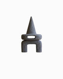Sculptural object crafted from volcanic rock with bold architectural geometry. A designer stone object created for contemporary interiors.