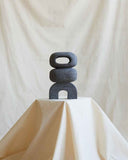 Contemporary volcanic rock accent object featuring artisan craftsmanship and organic stone textures. Designed as a statement furniture piece for modern spaces.