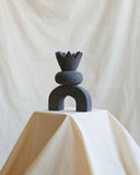 Designer object handcrafted from volcanic rock with a sculptural monolithic silhouette. Crafted to combine natural materials with contemporary design.