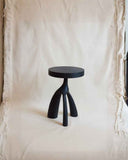 Designer wooden side table showcasing solid timber construction and clean sculptural lines. Crafted to bring warmth and elegance to contemporary interiors.