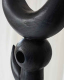 Designer object crafted from solid wood with sculptural proportions and timeless appeal. Created as a statement furniture piece for contemporary interiors.