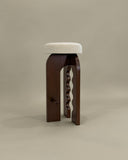 Contemporary wooden bench showcasing organic carved forms. Crafted to celebrate materiality and craftsmanship.
