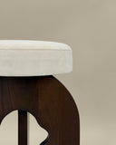 Sculptural timber bench with a monolithic profile. Crafted as a functional work of collectible design.