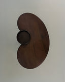 Luxury wood dining table featuring curved architectural forms. Designed to celebrate craftsmanship and materiality.