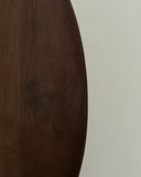 Designer dining table with an organic asymmetrical profile. Crafted to create visual impact in modern homes.