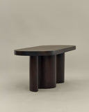 Luxury timber coffee table featuring handcrafted curved supports. Designed as a statement piece for contemporary interiors.