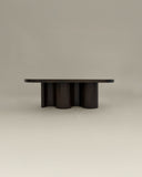 Sculptural centre table with an organic architectural silhouette. Designed to combine functionality and artistic expression.