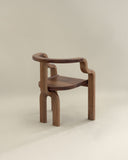 Luxury timber chair featuring handcrafted curved detailing. Designed for contemporary dining and living spaces.