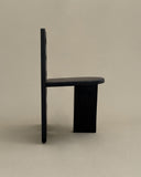 Contemporary wooden chair showcasing handcrafted sculptural forms. Crafted to create visual impact in sophisticated spaces.