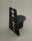 Sculptural dining chair with distinctive architectural detailing. Designed to celebrate craftsmanship and materiality.