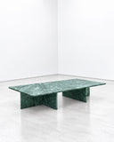Noemi Saga Bentinho Coffee Table featuring a rectangular green marble top with natural veining and sculptural intersecting slab legs. Its bold geometric construction and rich stone pattern create a distinctive contemporary centrepiece for luxury living spaces.