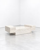 Noemi Saga Crystal Coffee Table featuring a low, angular composition of pale stone-like slabs with irregular, crystalline edges. Its sculptural geometric form and softly textured finish create a distinctive contemporary accent.