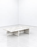 Noemi Saga Jabuti Coffee Table featuring an elongated, organically shaped white marble top with expressive grey veining and a sculptural slab base. Its natural stone pattern and minimalist construction bring refined character to contemporary living spaces.
