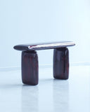Magma Bench by Onno Adriaanse featuring a sculptural oak form with a high-gloss resin finish. Collectible design bench inspired by the movement and texture of molten rock.