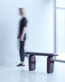 Luxury Magma Bench in hand-sculpted oak with a deep high-gloss finish. Contemporary collectible seating that combines organic form with artistic craftsmanship.