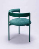 Contemporary designer chair showcasing premium green upholstery and refined craftsmanship. Crafted for sophisticated residential spaces.