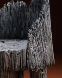 Designer chair showcasing artisan craftsmanship and architectural character. Crafted as a collectible furniture piece.