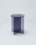 Contemporary acrylic side table featuring a polished finish and minimalist round form. Designed as a statement piece for modern residential spaces.